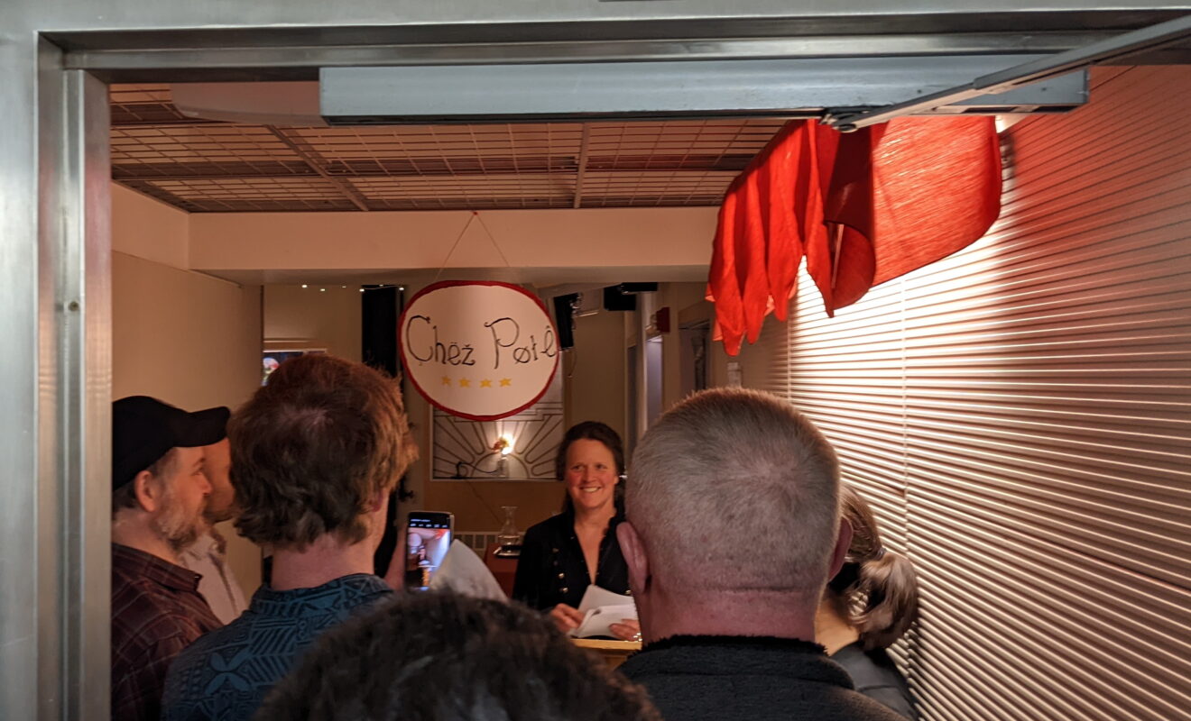 Hostess greeting guests at popup restaurant in South Pole station.