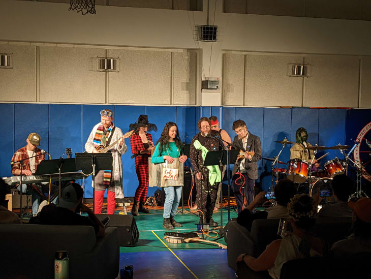 Local band members performing in South Pole gymnasium.