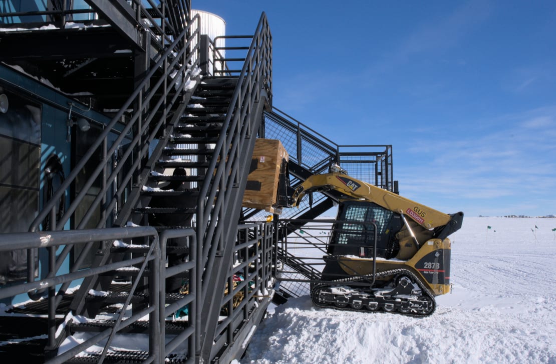 Large cargo crate being unloaded at the IceCube Lab.