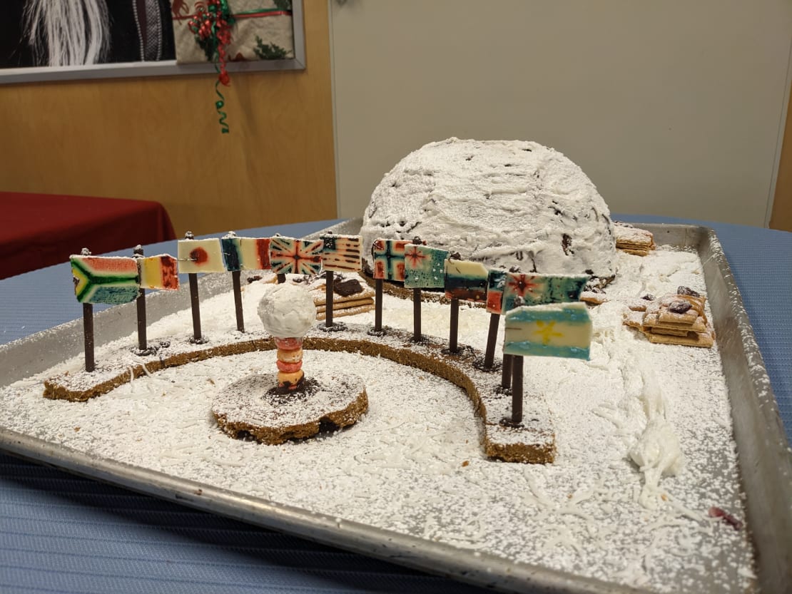 Gingerbread display of the old South Pole dome station and ceremonial pole.