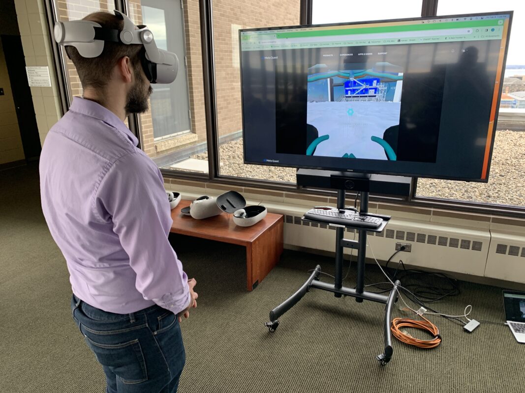 A man with a virtual reality headset playing a game