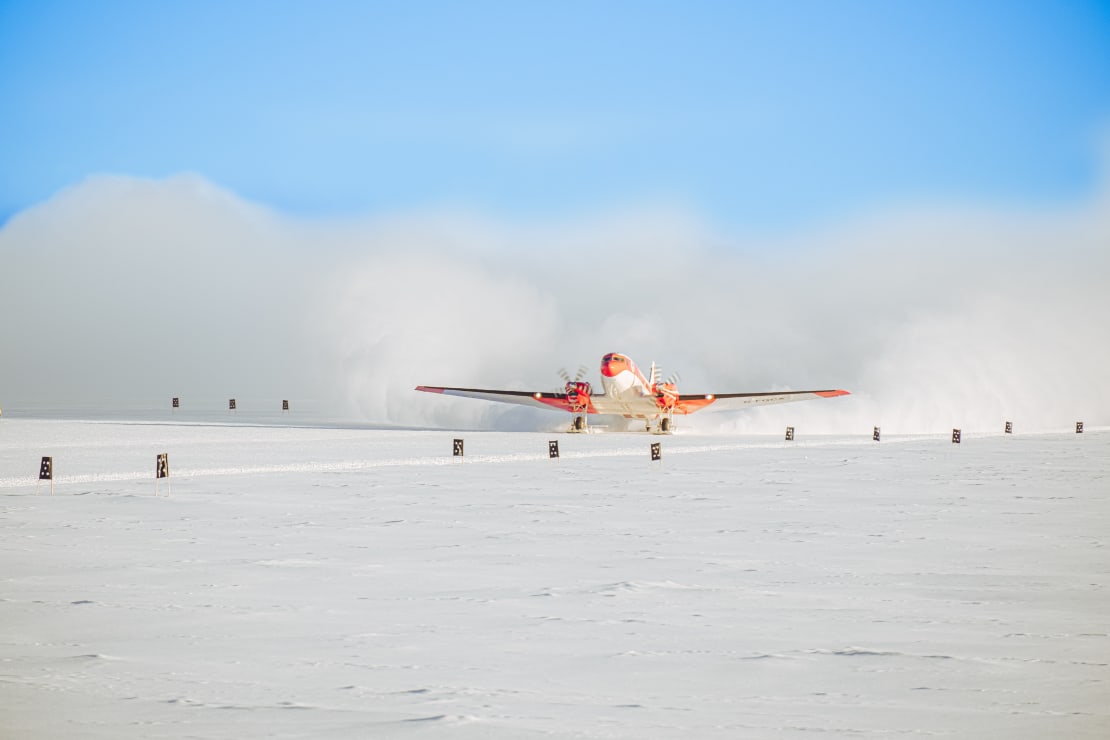 Front view of Basler plane as it is about to take off from South Pole skiway.