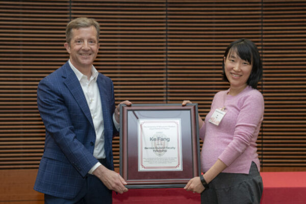 Department Chair and professor Mark Eriksson (left) presents assistant professor Ke Fang with the Bernice Durand Faculty Fellowship at the department awards banquet in May 2024